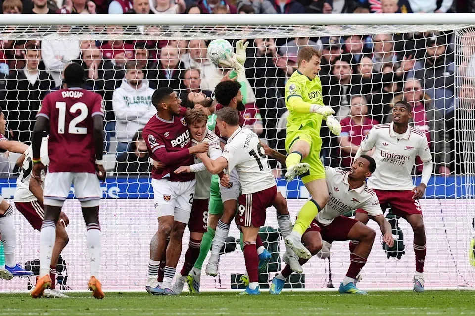 The referee Chris Kavanagh ruled that David Raya was fouled during the melee in the box (PA Wire)
