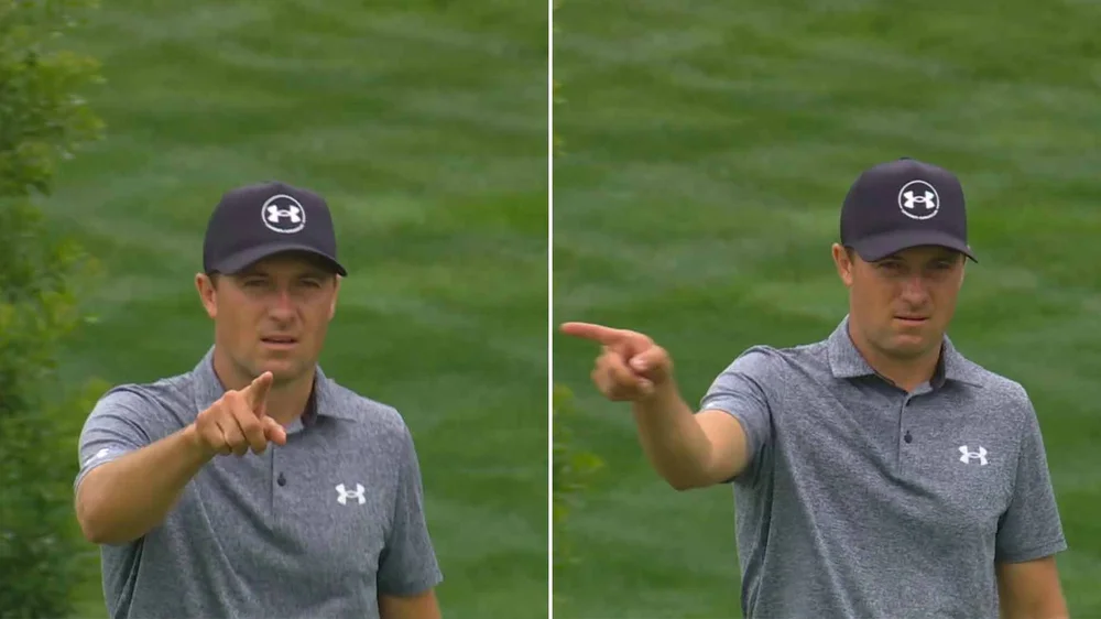 Jordan Spieth pointing at his caddie after making an eagle.